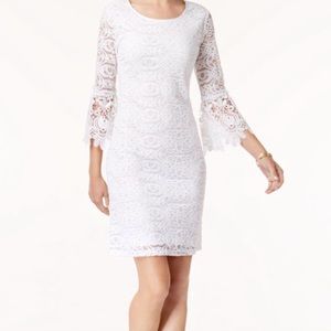 White lace Knee length dress with bell sleeves.